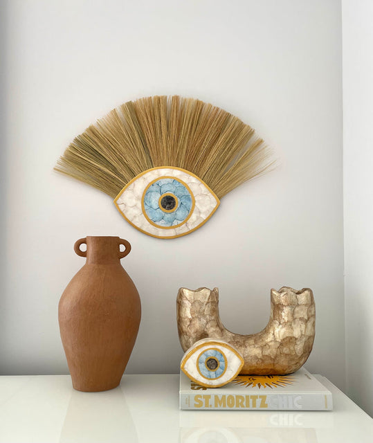 Handmade Decor made from Terracotta & then layered with Capiz Shell.  Our Evil Eye sculpture is a must have within your abode. 